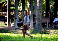 Young woman doing field (farm?) work at village near Siem Reap