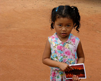 Child selling post cards at Angkor Wat